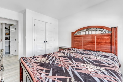 Bedroom featuring light wood-style floors and a closet - 2629 15A Avenue, Edmonton, AB - Indoor Photo Showing Bedroom