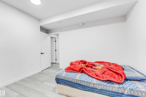 Bedroom featuring light wood-style floors and baseboards - 2629 15A Avenue, Edmonton, AB - Indoor Photo Showing Bedroom