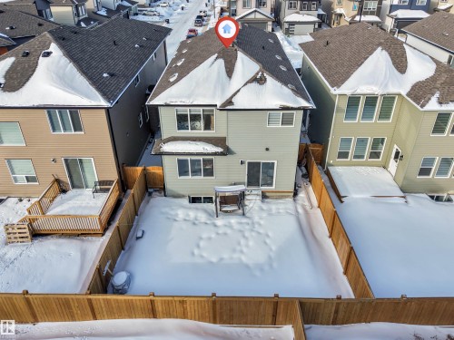 Snow covered property featuring a residential view and a deck - 2629 15A Avenue, Edmonton, AB - Outdoor