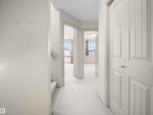 Corridor featuring light colored carpet - 1708 62 Street, Edmonton, AB - Indoor