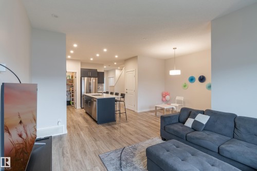 Living room featuring light wood finished floors and recessed lighting - 304 36 Avenue, Edmonton, AB - Indoor Photo Showing Living Room