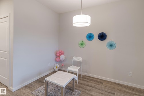 Sitting room with light wood finished floors - 304 36 Avenue, Edmonton, AB - Indoor Photo Showing Other Room