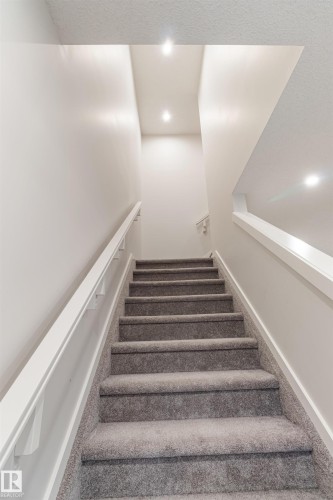Stairway featuring carpet and recessed lighting - 304 36 Avenue, Edmonton, AB - Indoor Photo Showing Other Room