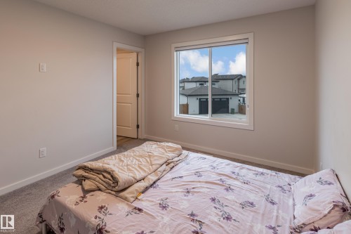 Bedroom featuring baseboards and carpet - 304 36 Avenue, Edmonton, AB - Indoor Photo Showing Bedroom