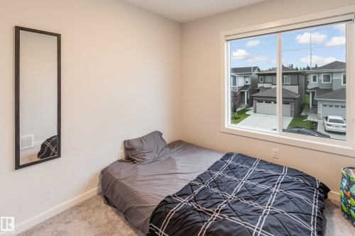 Carpeted bedroom with baseboards - 304 36 Avenue, Edmonton, AB - Indoor Photo Showing Bedroom