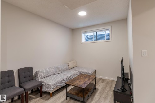 Living room featuring light wood finished floors and baseboards - 304 36 Avenue, Edmonton, AB - Indoor