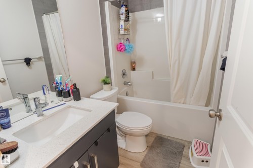 Full bathroom featuring vanity and shower / tub combo with curtain - 304 36 Avenue, Edmonton, AB - Indoor Photo Showing Bathroom