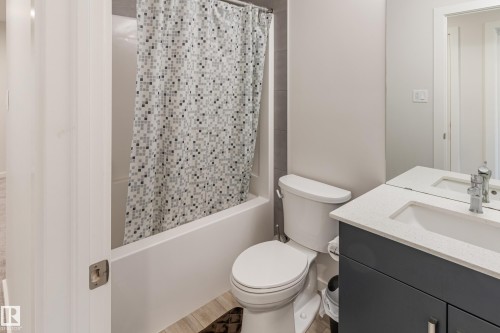 Full bathroom with vanity and shower / bath combination with curtain - 304 36 Avenue, Edmonton, AB - Indoor Photo Showing Bathroom