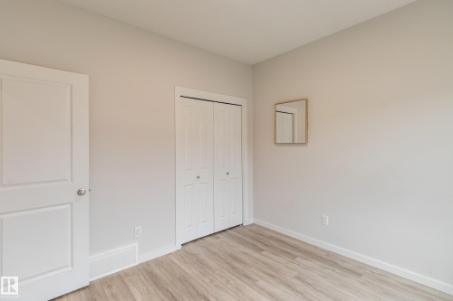 Unfurnished bedroom with light wood finished floors and a closet - 304 36 Avenue, Edmonton, AB - Indoor Photo Showing Other Room