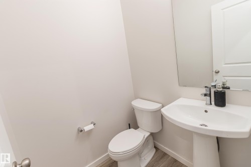 Bathroom featuring toilet and light wood finished floors - 304 36 Avenue, Edmonton, AB - Indoor Photo Showing Bathroom