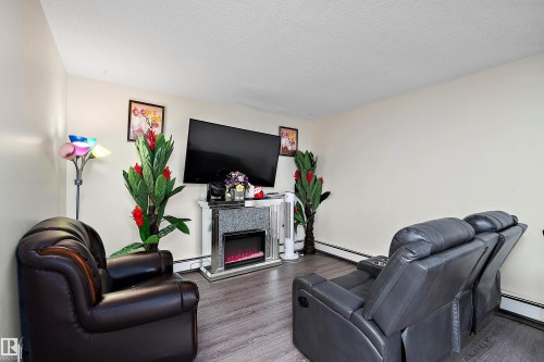 7 13460 Fort Rd, Edmonton, AB - Indoor Photo Showing Living Room With Fireplace
