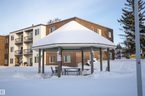 Snow covered house with brick siding - 207 11465 41 Avenue, Edmonton, AB - Outdoor