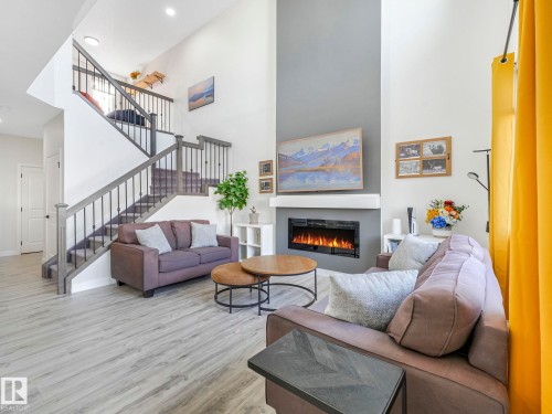 111 Bluff Cove, Leduc, AB - Indoor Photo Showing Living Room With Fireplace
