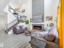 111 Bluff Cove, Leduc, AB  - Indoor Photo Showing Living Room With Fireplace 
