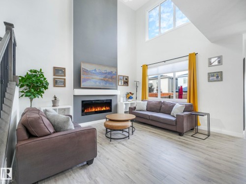 111 Bluff Cove, Leduc, AB - Indoor Photo Showing Living Room With Fireplace