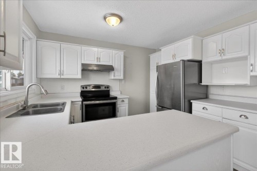 8 Erie Street S, Devon, AB - Indoor Photo Showing Kitchen With Double Sink