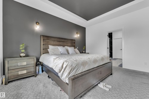 Carpeted bedroom featuring baseboards - 16812 48 Street Nw, Edmonton, AB - Indoor Photo Showing Bedroom