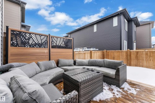 Wooden terrace featuring an outdoor lounge area and a fenced backyard - 16812 48 Street Nw, Edmonton, AB - Outdoor With Deck Patio Veranda With Exterior