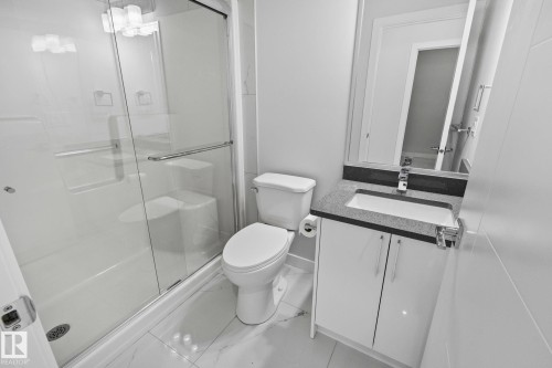 Full bath featuring vanity, a shower stall, and light marble finish floors - 3524 41 Ave, Beaumont, AB - Indoor Photo Showing Bathroom