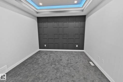 Empty room with a raised ceiling and carpet - 3524 41 Ave, Beaumont, AB - Indoor Photo Showing Other Room
