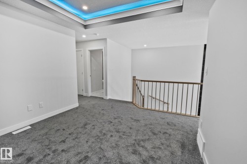 Unfurnished room with carpet and a tray ceiling - 3524 41 Ave, Beaumont, AB - Indoor Photo Showing Other Room