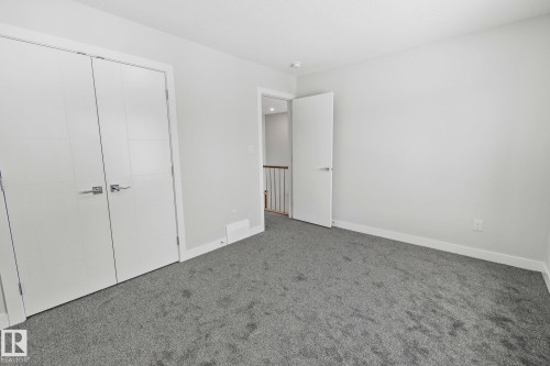 Unfurnished bedroom featuring carpet floors and a closet - 3524 41 Ave, Beaumont, AB - Indoor Photo Showing Other Room