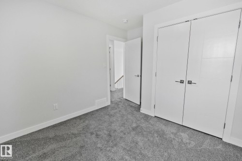 Unfurnished bedroom with carpet and a closet - 3524 41 Ave, Beaumont, AB - Indoor Photo Showing Other Room