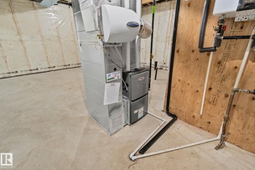 Utilities with heating unit - 3524 41 Ave, Beaumont, AB - Indoor Photo Showing Basement