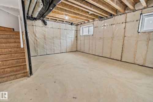 Basement featuring stairway - 3524 41 Ave, Beaumont, AB - Indoor Photo Showing Basement
