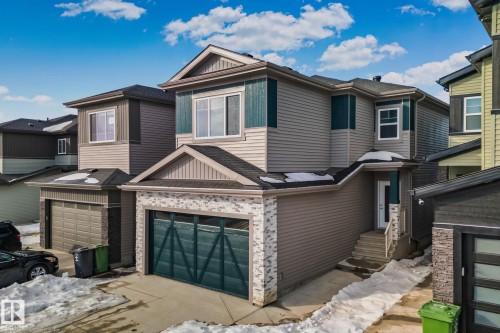 View of front facade with a garage and a shingled roof - 3524 41 Ave, Beaumont, AB - Outdoor