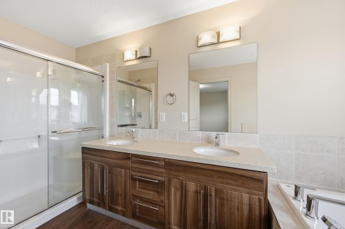 Bathroom featuring double vanity, a shower stall, and a bath - 1346 Cunningham Drive W, Edmonton, AB - Indoor Photo Showing Bathroom