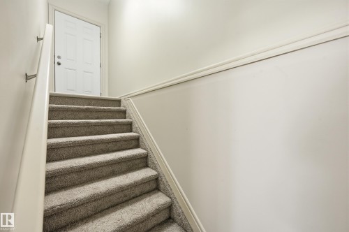 Stairs with carpet floors - 1346 Cunningham Drive W, Edmonton, AB - Indoor Photo Showing Other Room