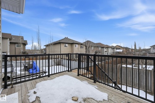 Snow covered deck with a residential view - 1346 Cunningham Drive W, Edmonton, AB - Outdoor With Exterior