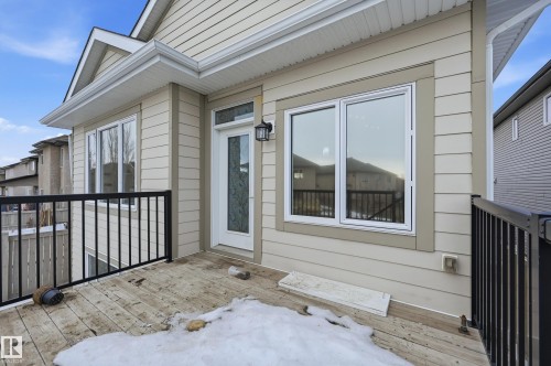 View of exterior entry with a wooden deck - 1346 Cunningham Drive W, Edmonton, AB - Outdoor With Exterior