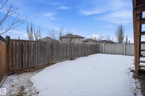 Snowy yard with a fenced backyard - 1346 Cunningham Drive W, Edmonton, AB - Outdoor