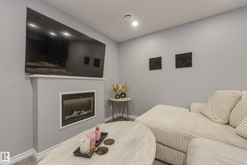 8 Ebbers Close, Edmonton, AB - Indoor Photo Showing Other Room With Fireplace