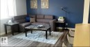 Living room featuring wood finished floors and baseboards - 13524 62 Street, Edmonton, AB  - Indoor Photo Showing Living Room 