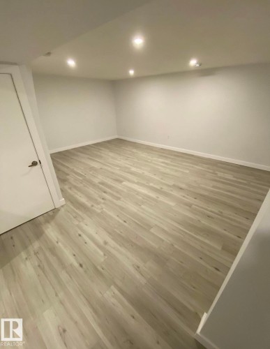 Finished below grade area featuring light wood-style floors and recessed lighting - 13524 62 Street, Edmonton, AB - Indoor