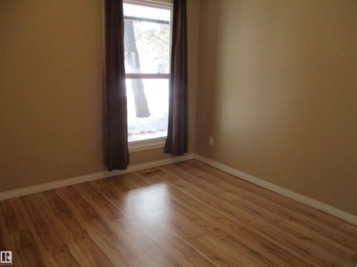 Spare room featuring baseboards and light wood-type flooring - 1186 Saddleback Road, Edmonton, AB - Indoor Photo Showing Other Room