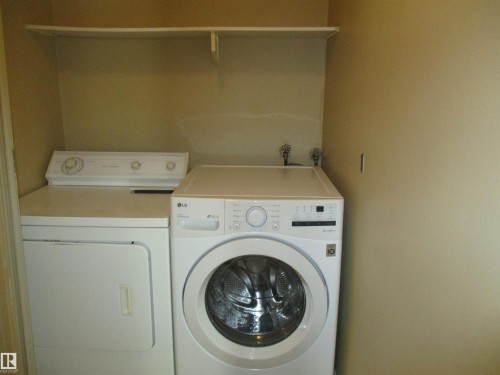 Laundry area featuring washing machine and dryer - 1186 Saddleback Road, Edmonton, AB - Indoor Photo Showing Laundry Room