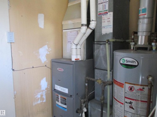 Utility room with water heater and heating unit - 1186 Saddleback Road, Edmonton, AB - Indoor Photo Showing Basement