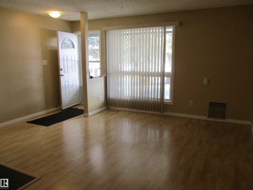 Entrance foyer featuring wood finished floors and baseboards - 1186 Saddleback Road, Edmonton, AB - Indoor Photo Showing Other Room