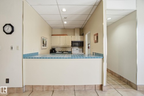 Party room kitchen and there are 2 bathrooms just behind. - 1105 8340 Jasper Avenue, Edmonton, AB - Indoor Photo Showing Kitchen