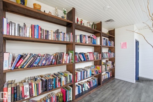 Sun Room library - 1105 8340 Jasper Avenue, Edmonton, AB - Indoor