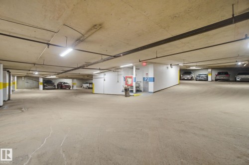 Parkade parking - 1105 8340 Jasper Avenue, Edmonton, AB - Indoor Photo Showing Garage