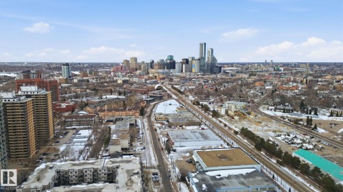 Ariel view from behind building showing LRT line and proximity to Downtown. - 1105 8340 Jasper Avenue, Edmonton, AB - Outdoor With View