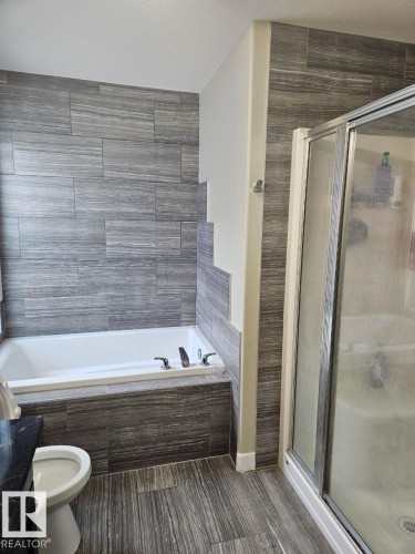 Full bath with a shower stall, a garden tub, and vanity - 208 Kirpatrick Way, Leduc, AB - Indoor Photo Showing Bathroom