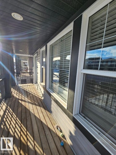 View of wooden terrace - 208 Kirpatrick Way, Leduc, AB - Outdoor With Deck Patio Veranda