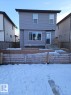View of snow covered back of property - 208 Kirpatrick Way, Leduc, AB  - Outdoor With Exterior 