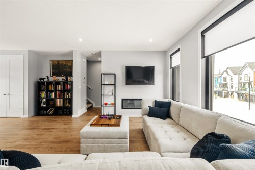 44 1304 Rutherford Road, Edmonton, AB - Indoor Photo Showing Living Room With Fireplace